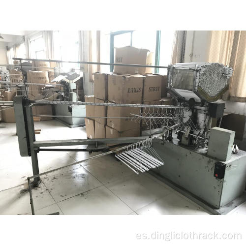 Máquina automática para fabricar revestimientos de tubos de puntal de papel